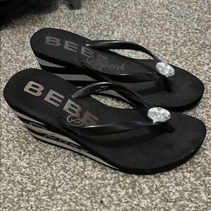 Bebe Black and White Wedge Flip Flops